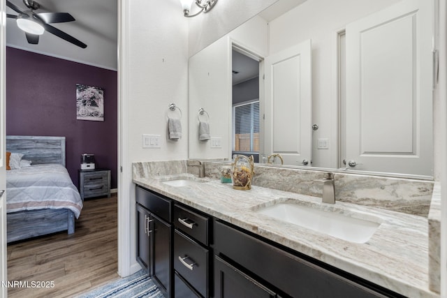 9435 Stony Hill Rd, Reno, NV 89521 - ensuite bathroom with double vanity, a ceiling fan, and wood finished floors