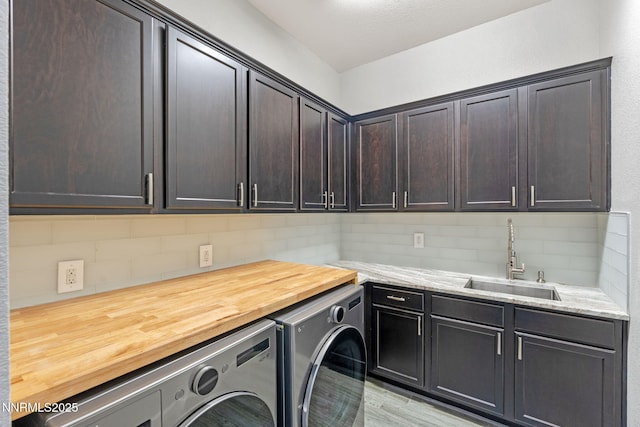 9435 Stony Hill Rd, Reno, NV 89521 - washroom featuring independent washer and dryer, cabinet space, and light wood-style flooring
