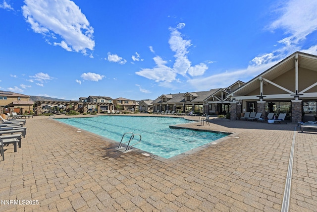 9435 Stony Hill Rd, Reno, NV 89521 - community pool featuring a patio area and a residential view