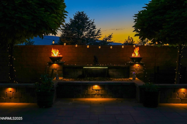 9435 Stony Hill Rd, Reno, NV 89521 - fenced backyard featuring a fire pit and a patio area