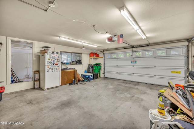 3279 Upland Ct, Carson City, NV 89703 - garage with freestanding refrigerator and a garage door opener