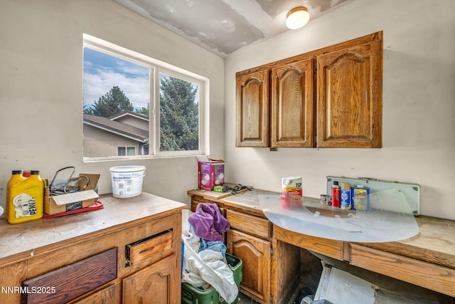 3279 Upland Ct, Carson City, NV 89703 - kitchen with light countertops and brown cabinetry