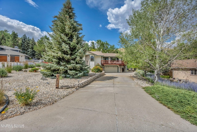 3279 Upland Ct, Carson City, NV 89703 - view of property hidden behind natural elements featuring concrete driveway and an attached garage