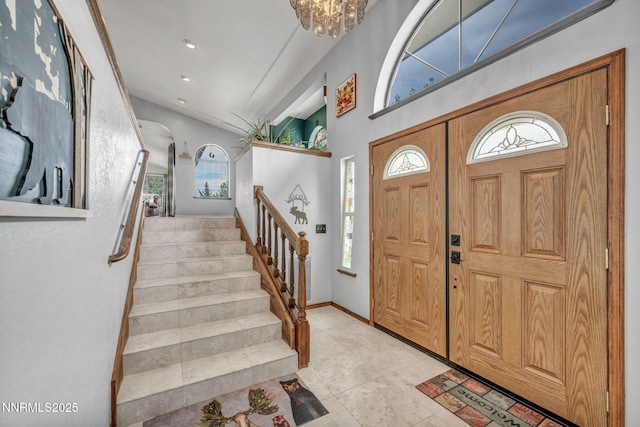 3279 Upland Ct, Carson City, NV 89703 - entrance foyer with stairway, a chandelier, light tile patterned flooring, and recessed lighting
