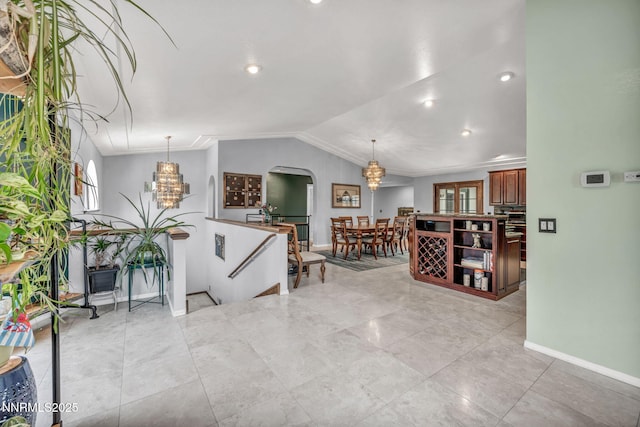 3279 Upland Ct, Carson City, NV 89703 - living area featuring a chandelier, vaulted ceiling, crown molding, recessed lighting, and light tile patterned floors