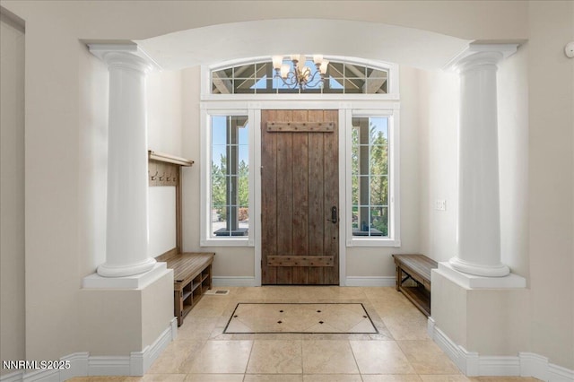 4990 Mountainshyre Rd, Reno, NV 89519 - foyer entrance featuring decorative columns, light tile patterned floors, and a chandelier