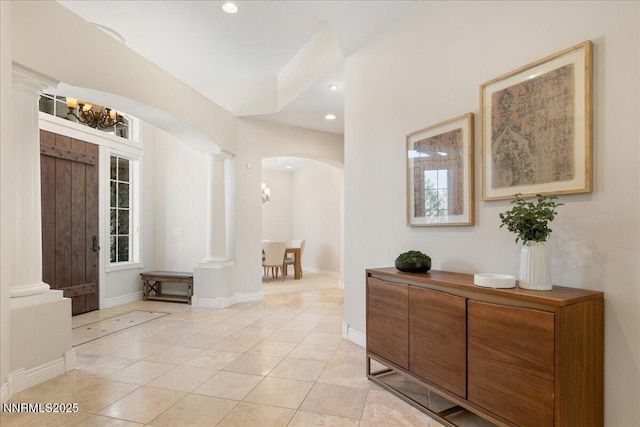 4990 Mountainshyre Rd, Reno, NV 89519 - foyer featuring arched walkways, ornate columns, a chandelier, light tile patterned floors, and recessed lighting