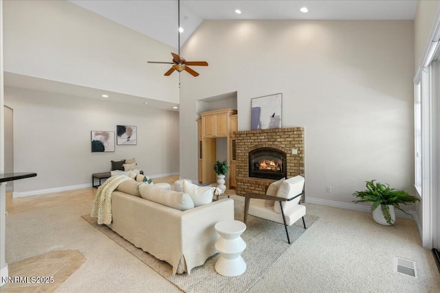 4990 Mountainshyre Rd, Reno, NV 89519 - living area featuring high vaulted ceiling, light colored carpet, a ceiling fan, a brick fireplace, and recessed lighting