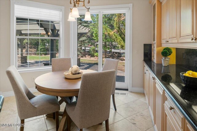 4990 Mountainshyre Rd, Reno, NV 89519 - dining room with light tile patterned floors and a chandelier