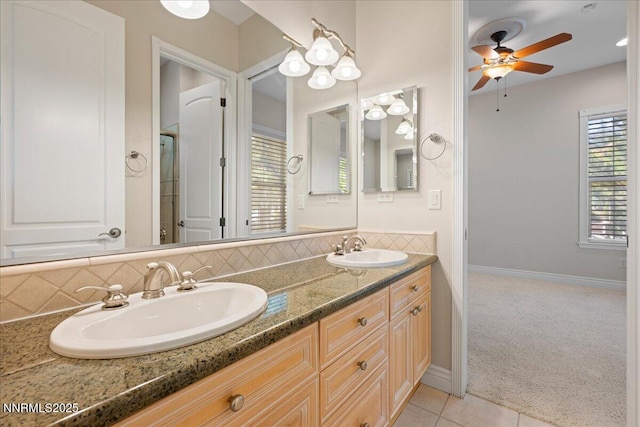 4990 Mountainshyre Rd, Reno, NV 89519 - bathroom with double vanity, a ceiling fan, tile patterned floors, and backsplash