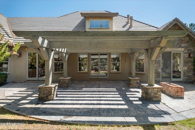 4990 Mountainshyre Rd, Reno, NV 89519 - back of property featuring a pergola, a patio area, a tile roof, and stucco siding