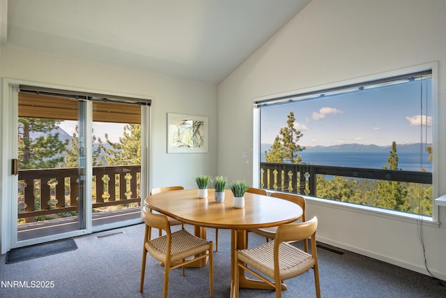 1459 Glarus Ct, Incline Village, NV 89451 - carpeted dining room with vaulted ceiling, plenty of natural light, and a water view