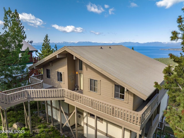 1459 Glarus Ct, Incline Village, NV 89451 - back of house with a metal roof and a deck with water view