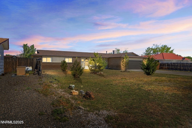 684 Carson River Dr, Fallon, NV 89406 - view of front facade featuring brick siding, driveway, and an attached garage