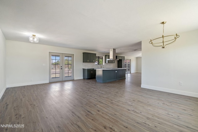 684 Carson River Dr, Fallon, NV 89406 - unfurnished living room featuring french doors, a chandelier, and wood finished floors