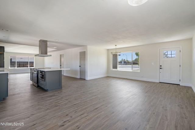 684 Carson River Dr, Fallon, NV 89406 - unfurnished living room featuring a chandelier and wood finished floors