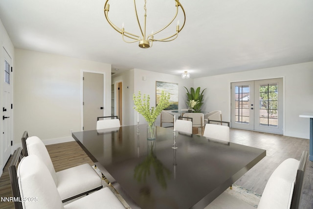 684 Carson River Dr, Fallon, NV 89406 - dining space with french doors, wood finished floors, and a chandelier