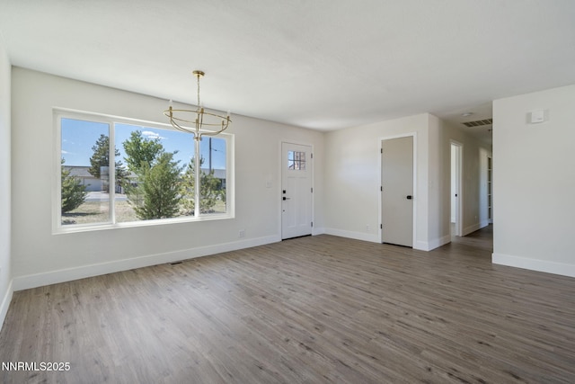 684 Carson River Dr, Fallon, NV 89406 - foyer entrance featuring a chandelier, wood finished floors, and plenty of natural light