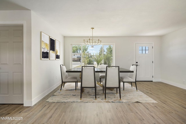 684 Carson River Dr, Fallon, NV 89406 - dining space featuring wood finished floors, healthy amount of natural light, and a chandelier