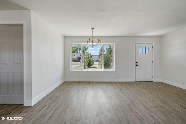684 Carson River Dr, Fallon, NV 89406 - entrance foyer with wood finished floors and a chandelier