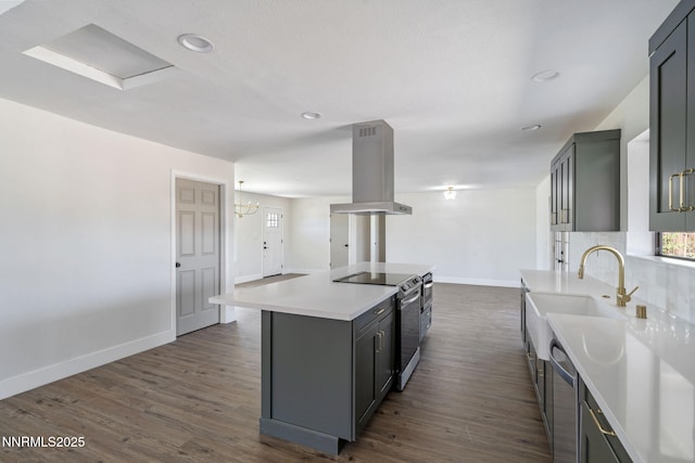 684 Carson River Dr, Fallon, NV 89406 - kitchen featuring appliances with stainless steel finishes, island range hood, light countertops, gray cabinetry, and recessed lighting