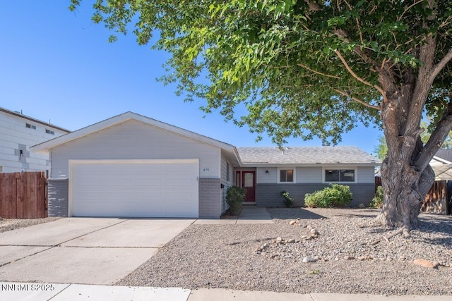 875 Camino Real Dr, Sparks, NV 89434 - single story home featuring an attached garage, driveway, and brick siding