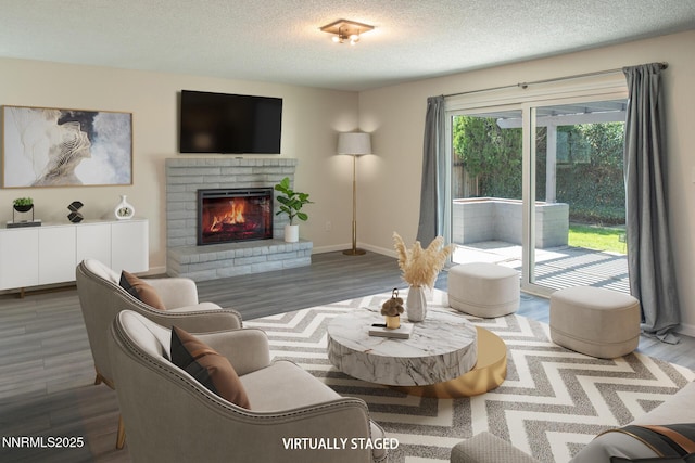 875 Camino Real Dr, Sparks, NV 89434 - living area featuring wood finished floors, a textured ceiling, and a brick fireplace