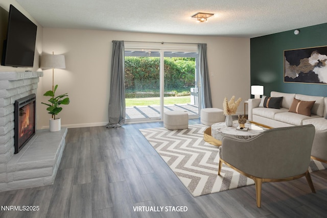 875 Camino Real Dr, Sparks, NV 89434 - living area with a brick fireplace, a textured ceiling, and wood finished floors