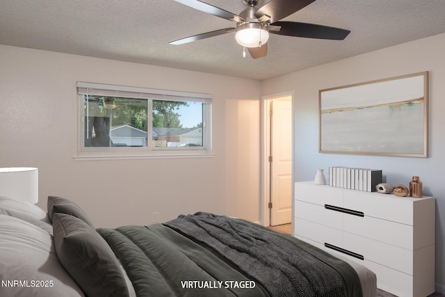 875 Camino Real Dr, Sparks, NV 89434 - bedroom featuring a textured ceiling and ceiling fan