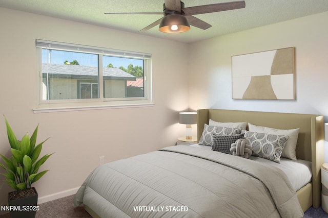 875 Camino Real Dr, Sparks, NV 89434 - bedroom with carpet flooring, ceiling fan, and a textured ceiling