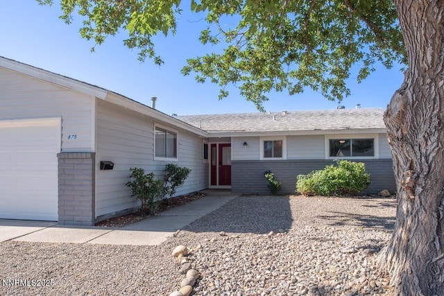 875 Camino Real Dr, Sparks, NV 89434 - ranch-style home with brick siding and an attached garage