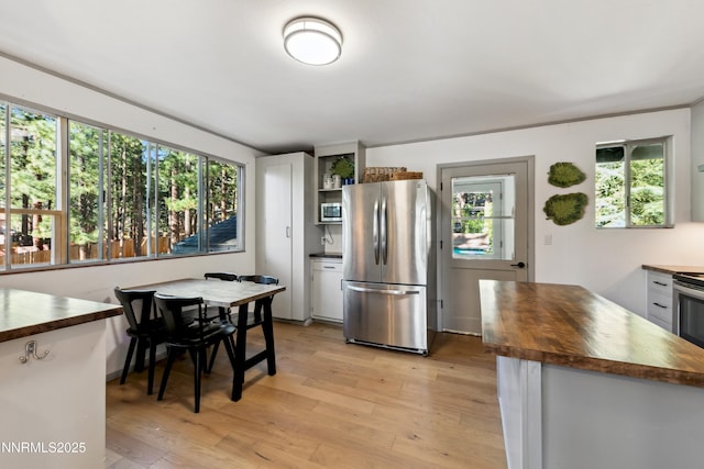 299 Chimney Rock Rd, Stateline, NV 89449 - kitchen featuring stainless steel appliances, butcher block counters, open shelves, and plenty of natural light