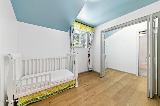 299 Chimney Rock Rd, Stateline, NV 89449 - bedroom featuring wood finished floors and a nursery area