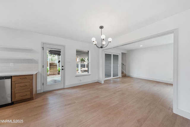 1305 Gault Way, Sparks, NV 89431 - unfurnished dining area featuring a chandelier, light wood-style flooring, and stairway