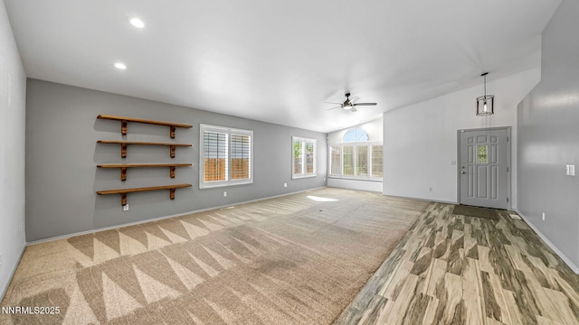2015 Flycatcher Dr, Spanish Springs, NV 89441 - unfurnished living room featuring ceiling fan, lofted ceiling, wood finished floors, and recessed lighting