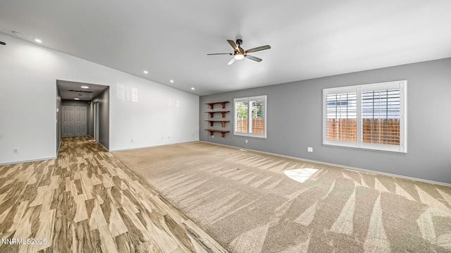 2015 Flycatcher Dr, Spanish Springs, NV 89441 - empty room featuring ceiling fan, recessed lighting, built in shelves, light wood-style floors, and light colored carpet