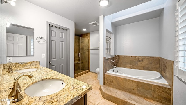 2015 Flycatcher Dr, Spanish Springs, NV 89441 - full bath featuring double vanity, a shower stall, tile patterned floors, and a garden tub