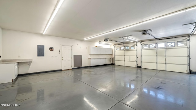 2015 Flycatcher Dr, Spanish Springs, NV 89441 - garage featuring electric panel and a garage door opener