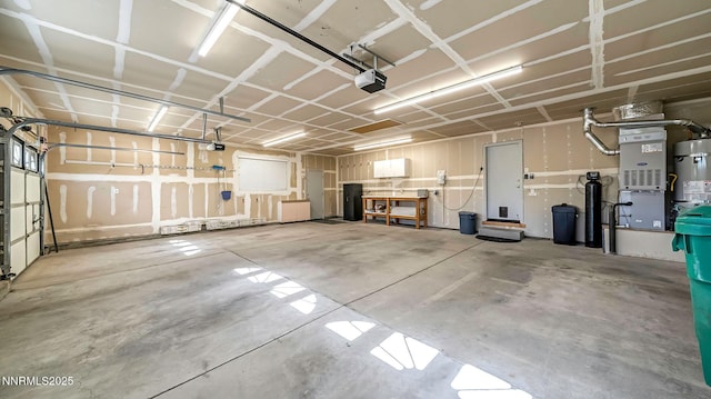 2015 Flycatcher Dr, Spanish Springs, NV 89441 - garage with a garage door opener and secured water heater