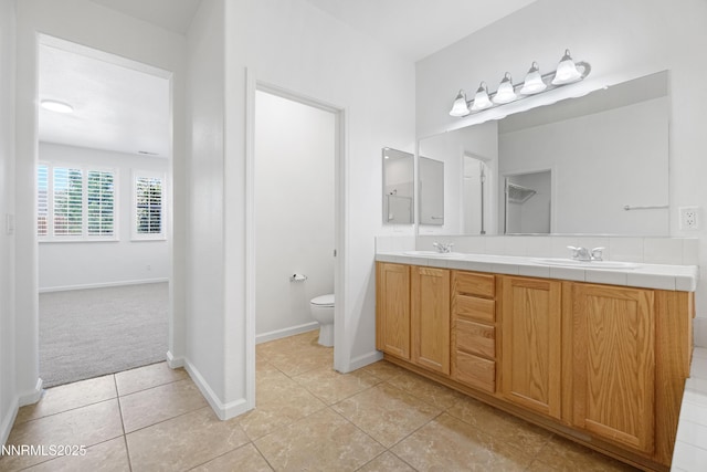169 Oakridge Dr, Dayton, NV 89403 - full bathroom with double vanity and tile patterned flooring