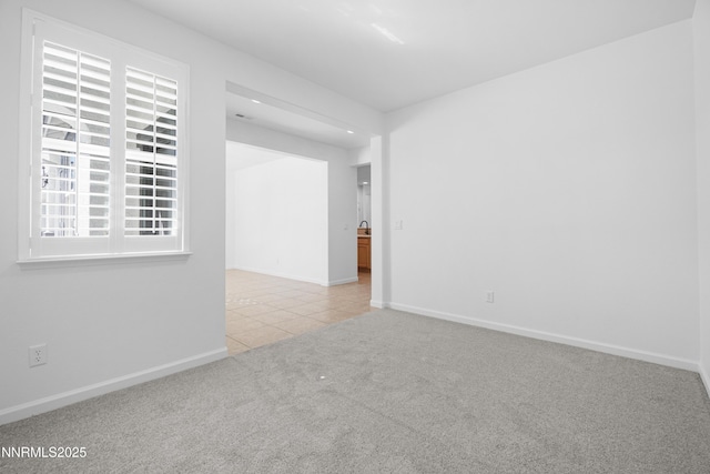 169 Oakridge Dr, Dayton, NV 89403 - carpeted spare room with tile patterned flooring and baseboards