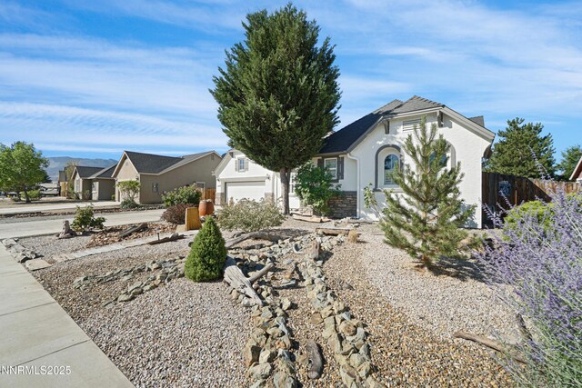 169 Oakridge Dr, Dayton, NV 89403 - ranch-style house featuring stucco siding and a garage