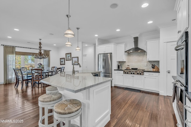 600 Artemesia Ln, Gardnerville, NV 89460 - kitchen with wall chimney range hood, stainless steel appliances, decorative backsplash, white cabinets, and crown molding