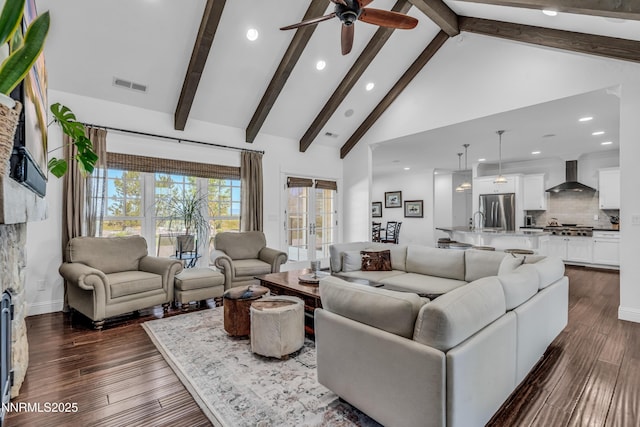 600 Artemesia Ln, Gardnerville, NV 89460 - living area with a ceiling fan, recessed lighting, beamed ceiling, high vaulted ceiling, and a stone fireplace