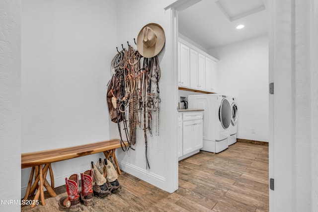600 Artemesia Ln, Gardnerville, NV 89460 - washroom featuring cabinet space, washing machine and clothes dryer, light wood-style floors, recessed lighting, and attic access