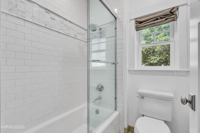 600 Artemesia Ln, Gardnerville, NV 89460 - bathroom featuring toilet and bath / shower combo with glass door