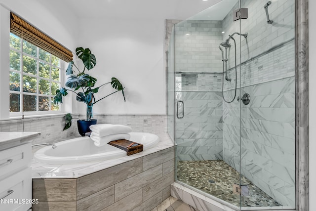 600 Artemesia Ln, Gardnerville, NV 89460 - full bathroom featuring a garden tub, a shower stall, vanity, tile patterned floors, and recessed lighting