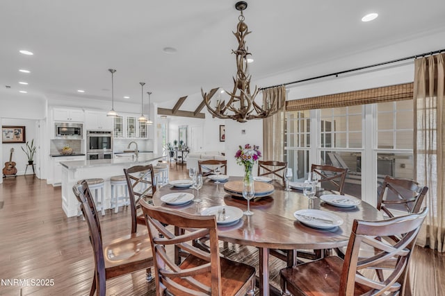 600 Artemesia Ln, Gardnerville, NV 89460 - dining space featuring recessed lighting, a chandelier, and wood finished floors