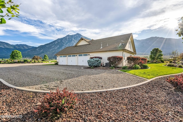 600 Artemesia Ln, Gardnerville, NV 89460 - view of property exterior featuring a mountain view, driveway, a garage, and roof with shingles