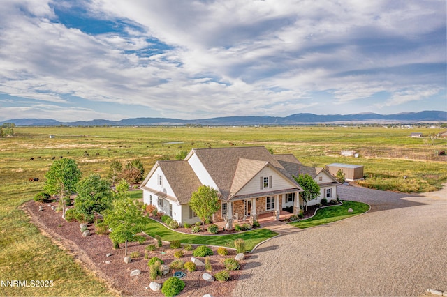 600 Artemesia Ln, Gardnerville, NV 89460 - view of front facade with a mountain view, driveway, a porch, and an attached garage
